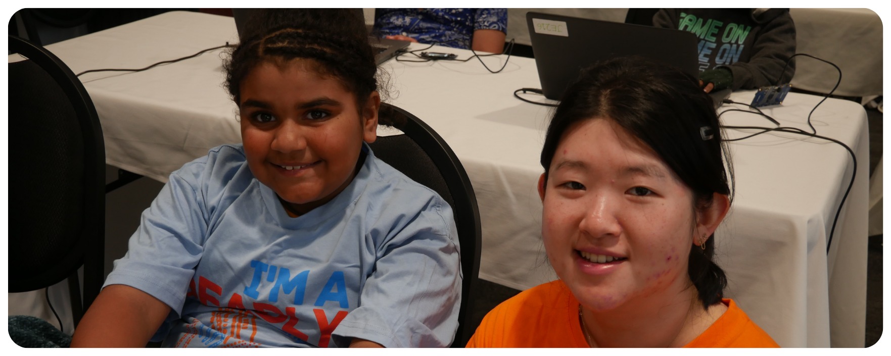 Young Indigenous student and her instructor at a Minitendo Workshop by Deadly Coders